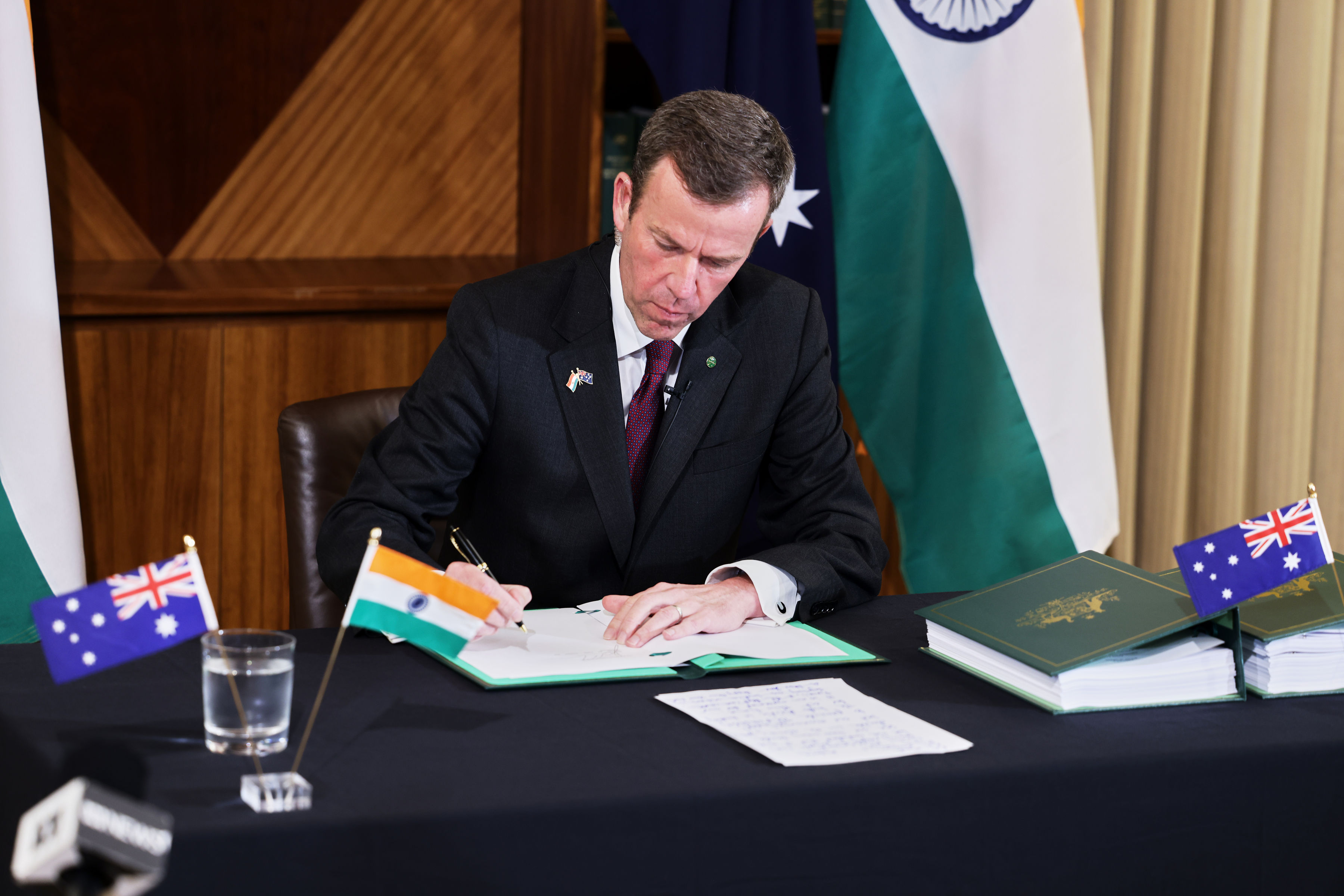 Australia’s Minister for Trade, Tourism and Investment, Dan Tehan MP, signs the Australia-India Economic Cooperation and Trade Agreement